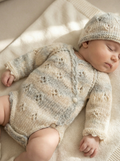 sophyia wearing cozy knit newborn clothes, handmade with premium Egyptian cotton – the perfect new born baby gift.
