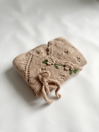 Luxurious handmade knit newborn clothes, featuring delicate floral embroidery – the perfect baby knitwear gift for your little one