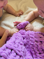 faia and sophyia with a soft, 100% handmade crochet baby blanket in vibrant purple, providing warmth and comfort – the perfect newborn baby gift